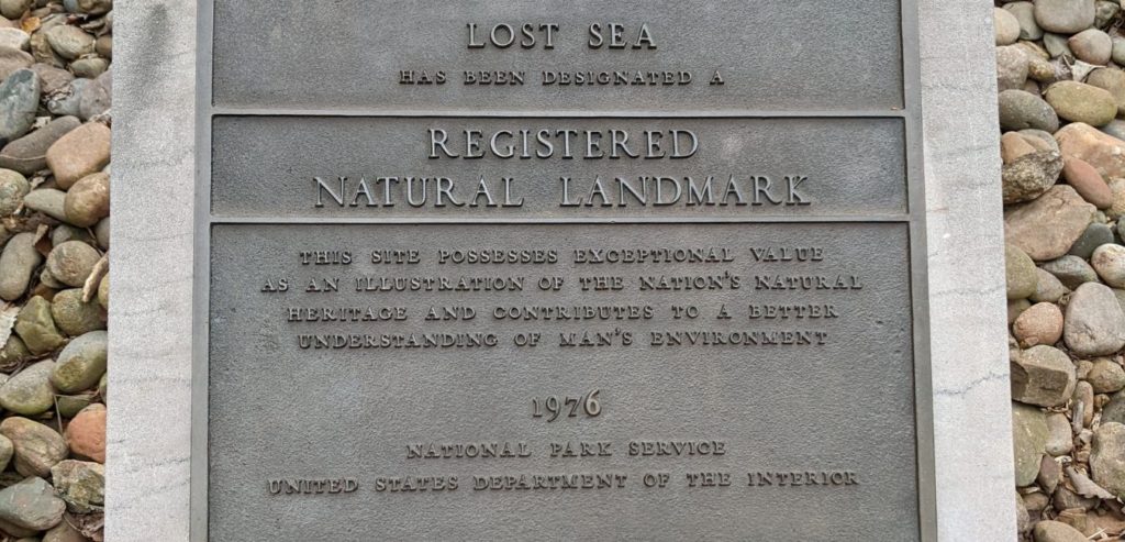 A plaque outside Craighead Caverns proclaiming the Lost Sea to be a Registered National Landmark.