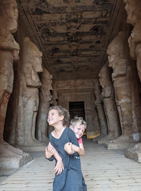 Two kids excited to be inside Abu Simbel