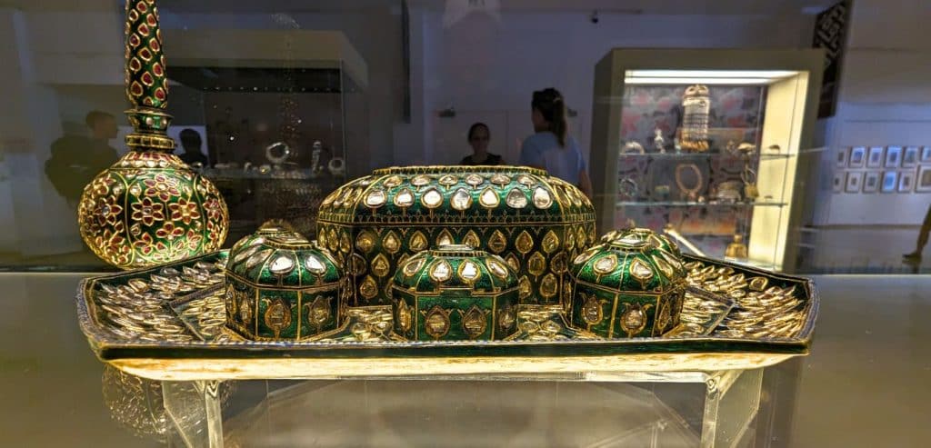 A beautiful set of gold and green ceremonial boxes on display at the Islamic Arts Museum of Malaysia.