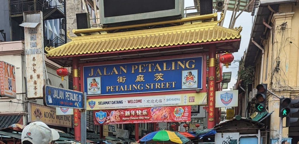 An ornate sign welcoming visitors to Petaling Street Market in Kuala Lumpur.