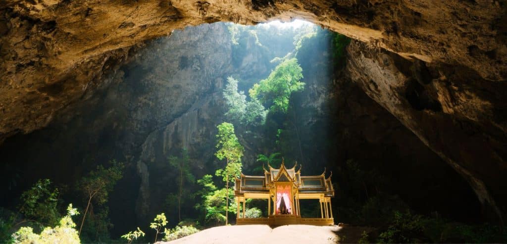 Light from a hole in the cave ceiling illuminates the pagoda inside Phraya Nakhon Cave.