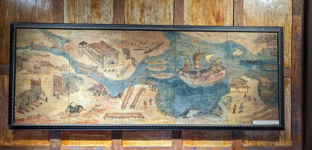 A picture of a ship on the water in the Folk Culture Museum.