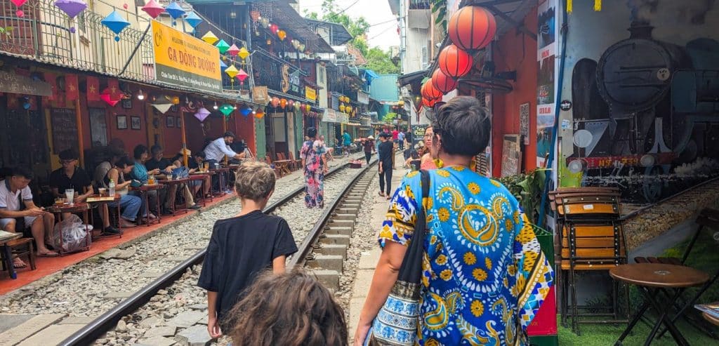 My family on our way to a Train Street cafe in Hanoi.
