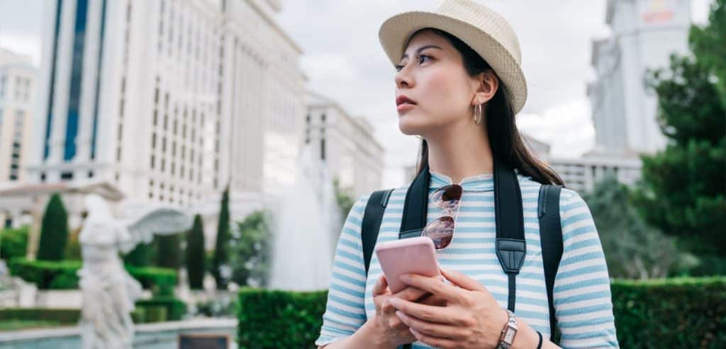 Tourist using her phone to get around