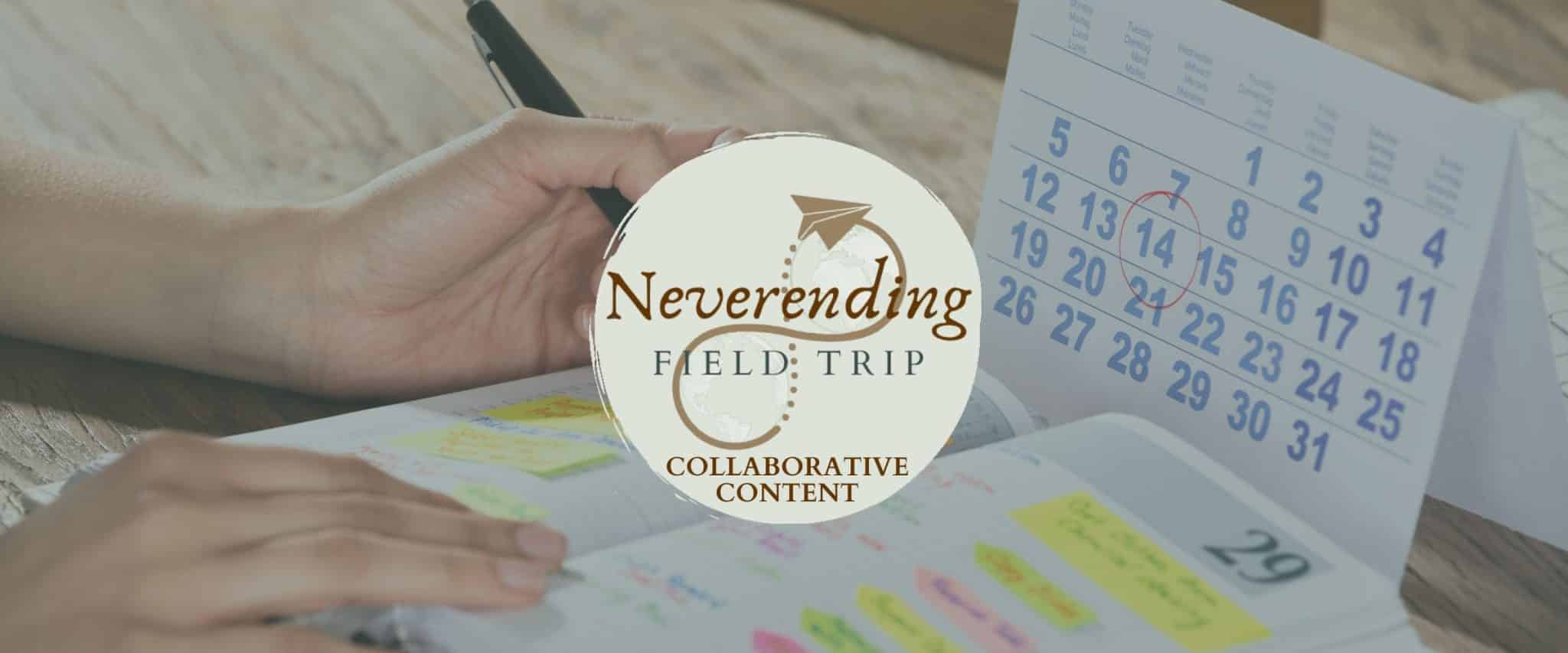 Someone writing in an open planner with a calendar behind it