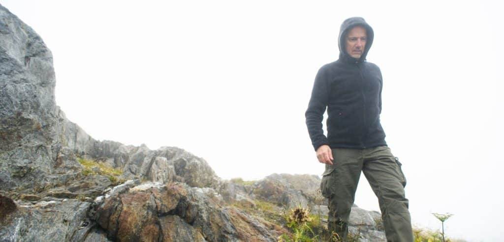 A man wearing cold weather hiking gear