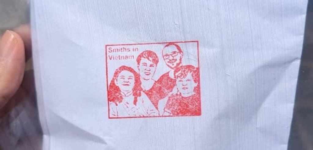 A hand-carved stamp depicting a family